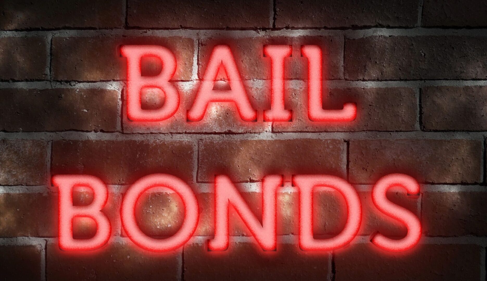 A brick wall with the words bail bonds written in neon.